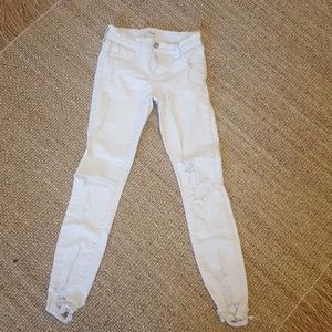Distressed white girls jeans